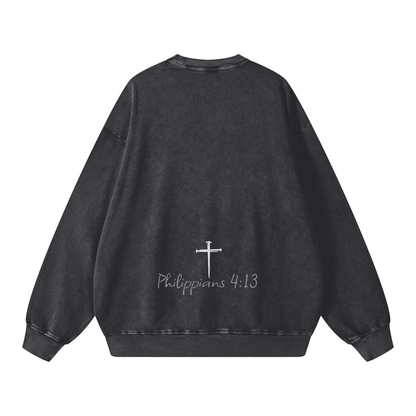 Black sweatshirt with a cross and text on the back against a white background