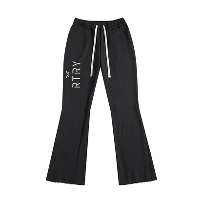 Black flared pants with 'RTRY' logo on a white background