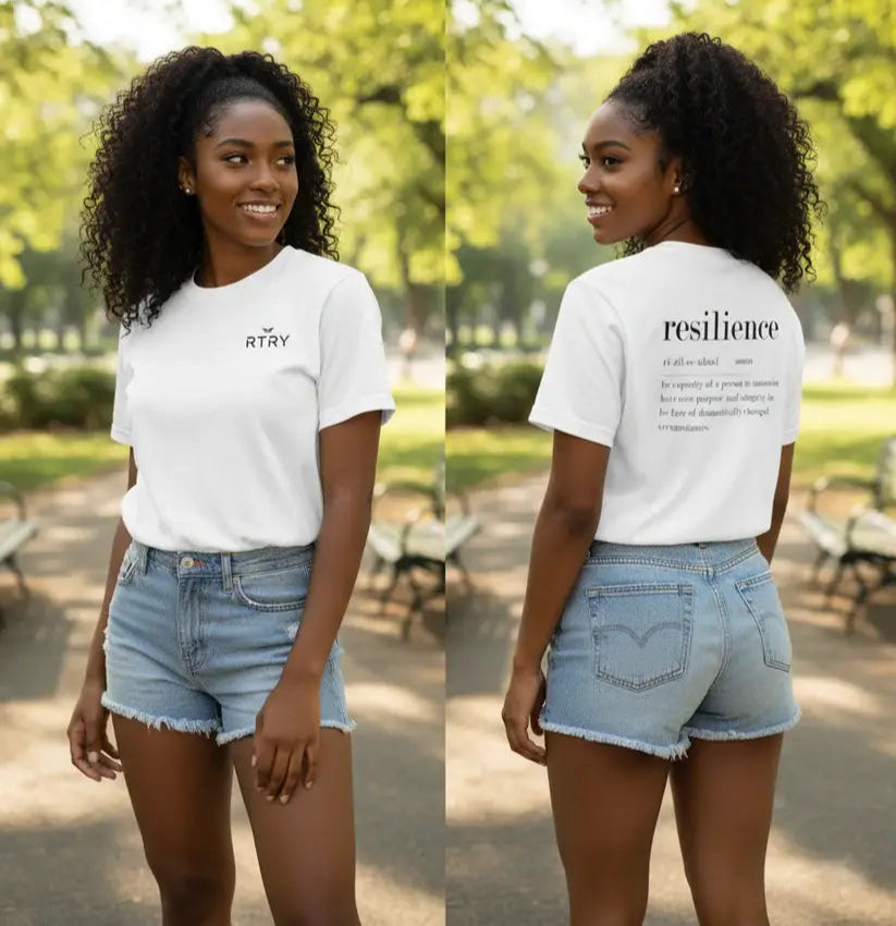 Woman wearing a white t-shirt with text outdoors